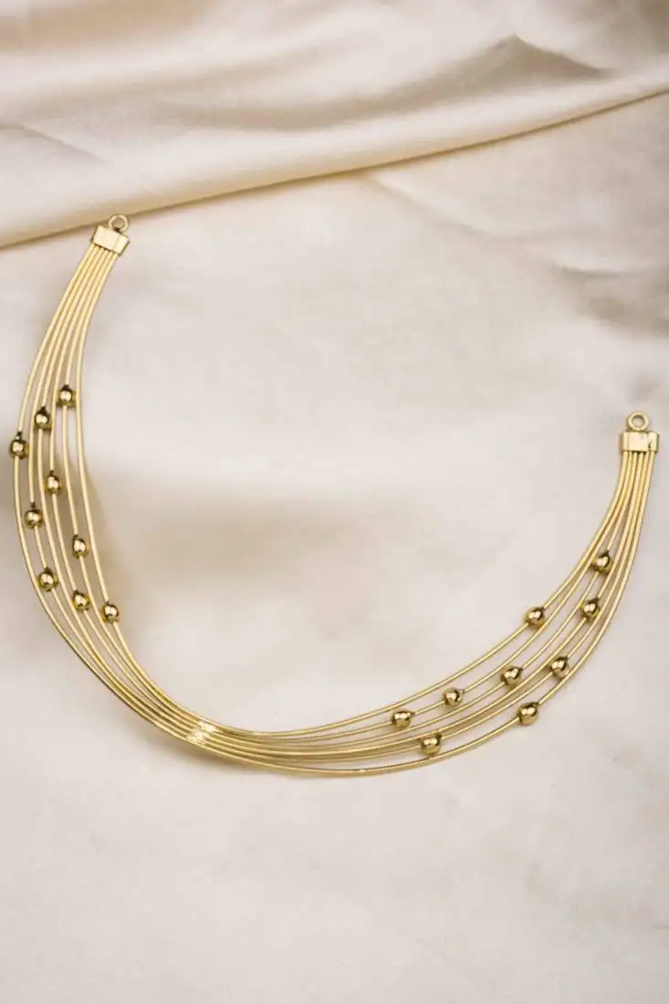 Gold finish multi layers hasli necklace with gold beads