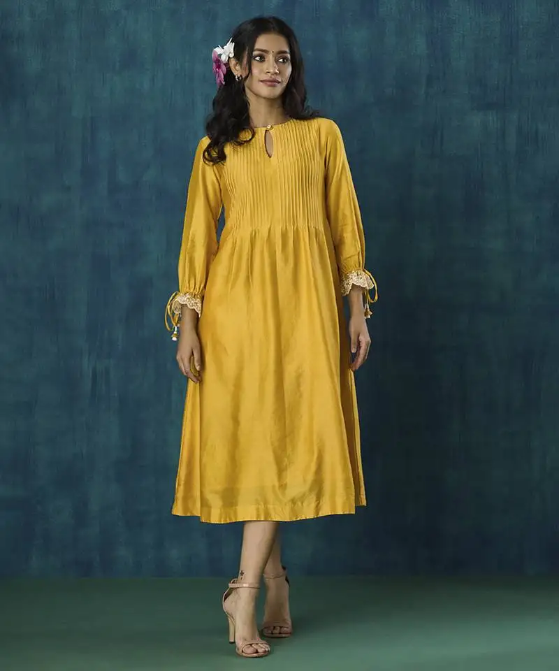 Yellow plain flowy chanderi kurta with handmade tassels