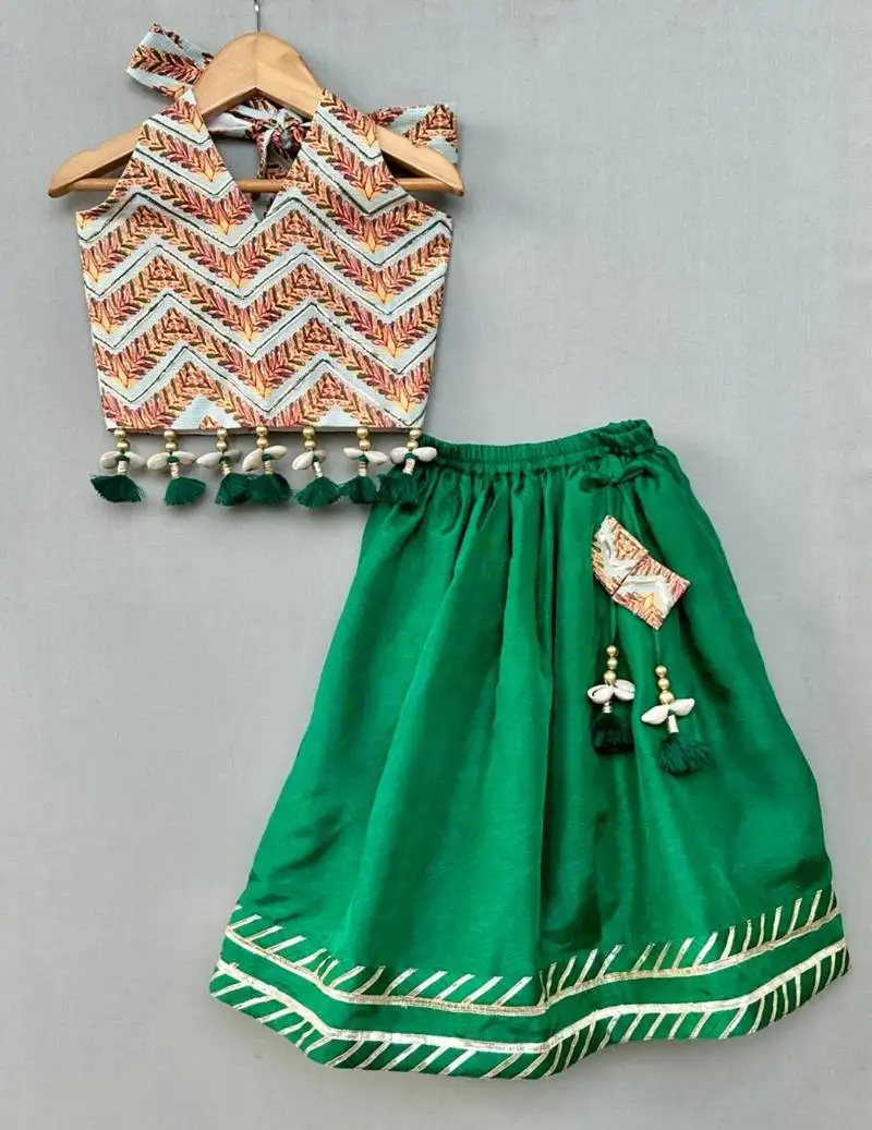 Stylish halter top with matching green lehenga for girls