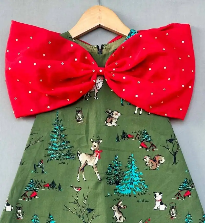 Animal printed green aline dress with big red bow for girls