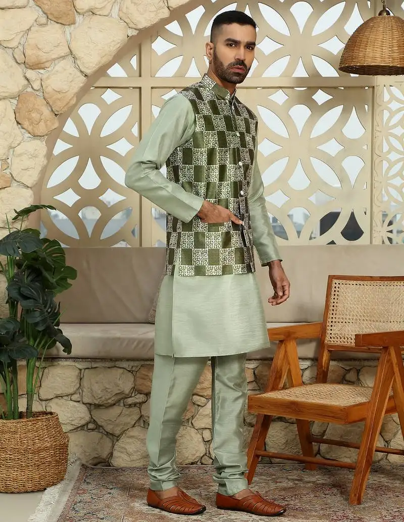 Silk blend solid olive kurta and churidar with green printed nehru jacket
