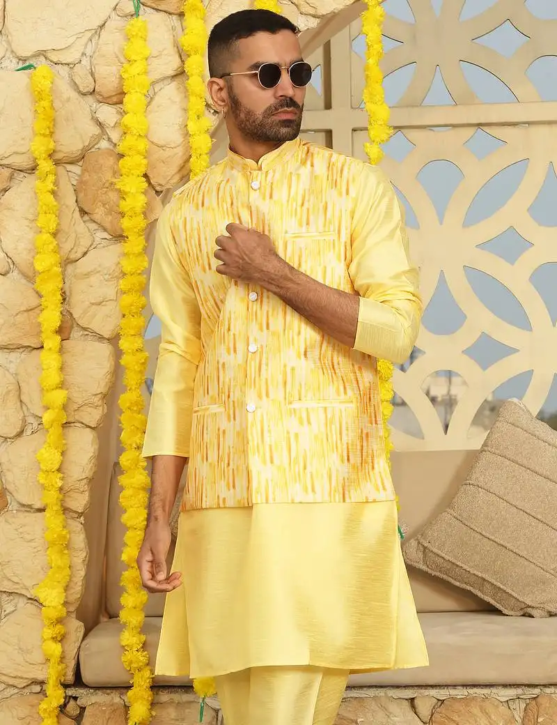 Silk blend solid yellow kurta and churidar with tie-dye yellow nehru jacket