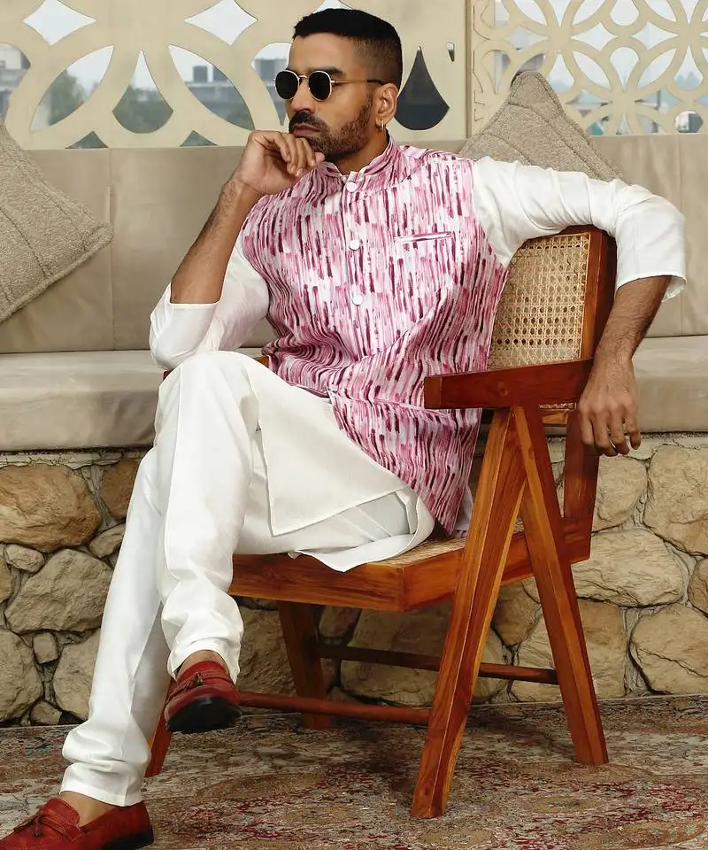 Silk blend solid cream kurta and churidar with tie-dye wine nehru jacket