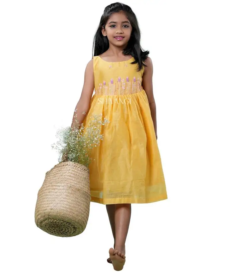 Yellow checks rice corn pattu pavadai frocks for kids