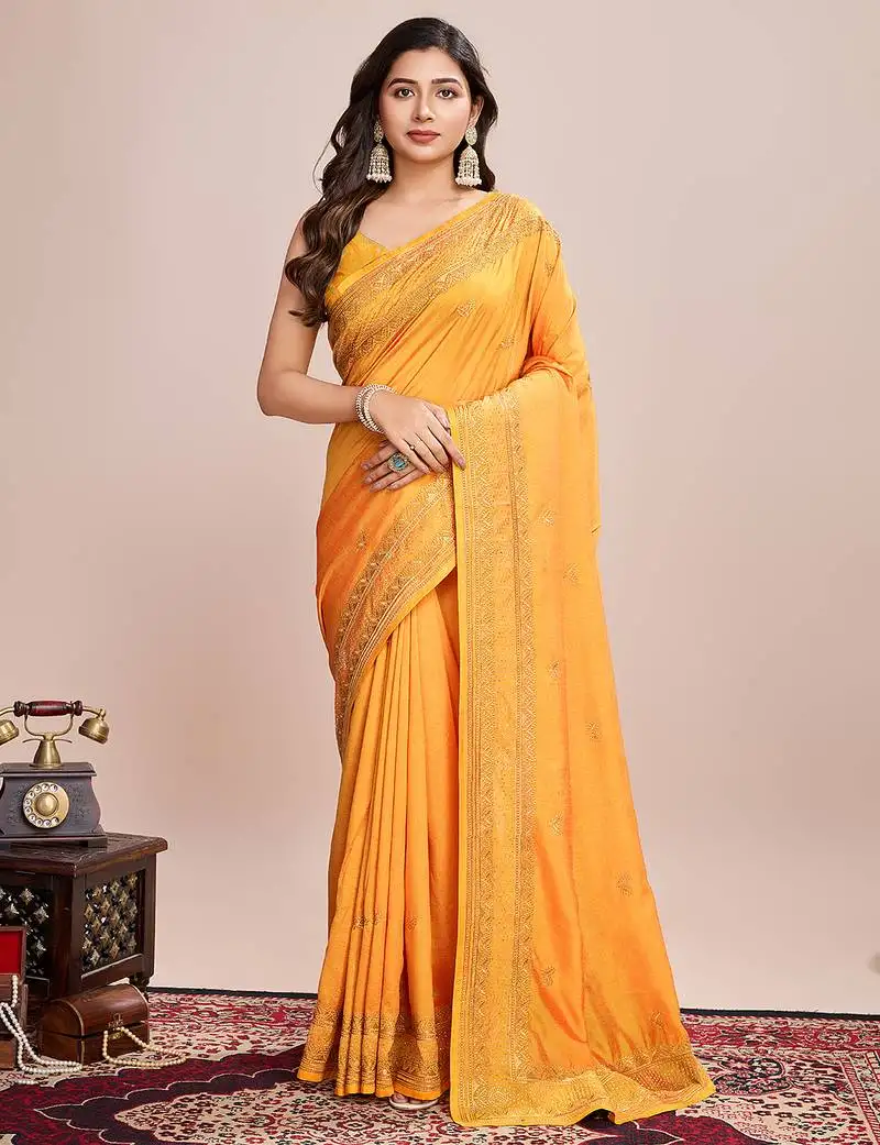 Yellow silk blend saree with contrast zari border pallu and matching blouse