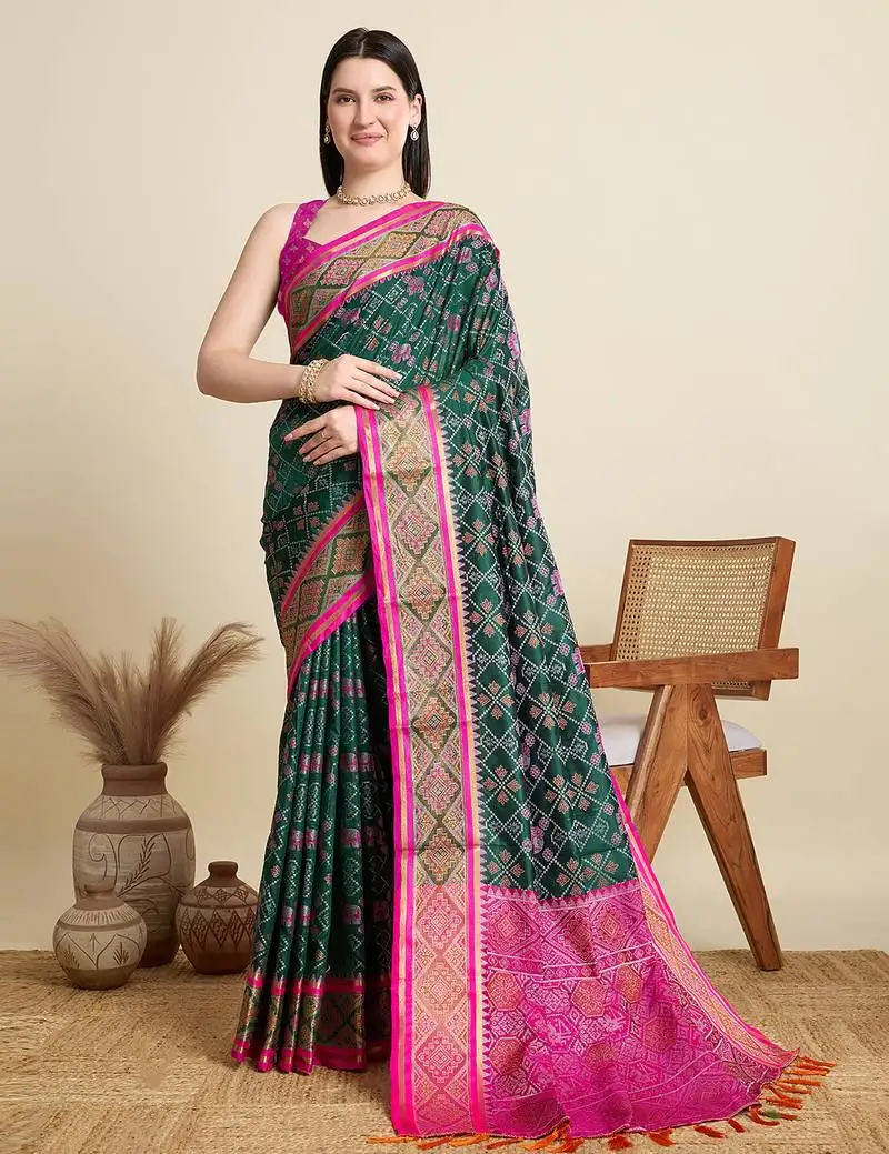 Green patola silk blend saree with contrast weave meenakari & tassels