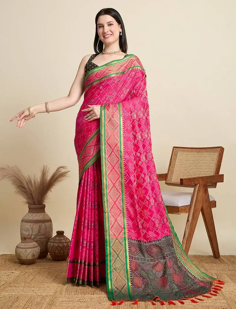 Pink patola silk blend saree with contrast weave meenakari & tassels
