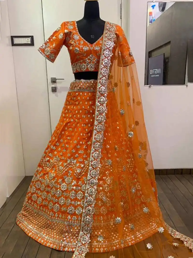 Orange zari work silk lehenga choli with net dupatta