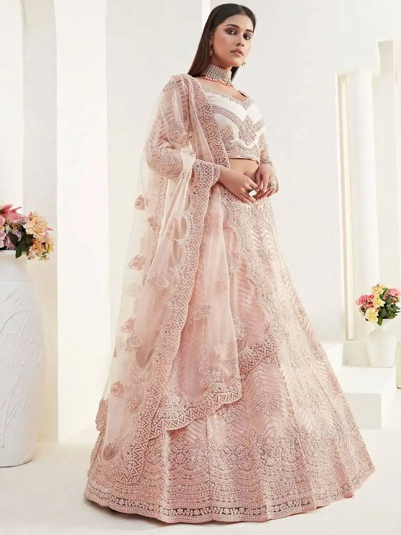 Peach net stone work wedding wear lehenga choli with dupatta