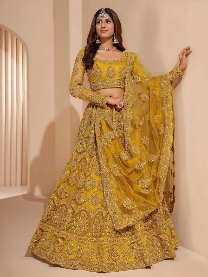 Mustard yellow net function wear lehenga choli with dupatta