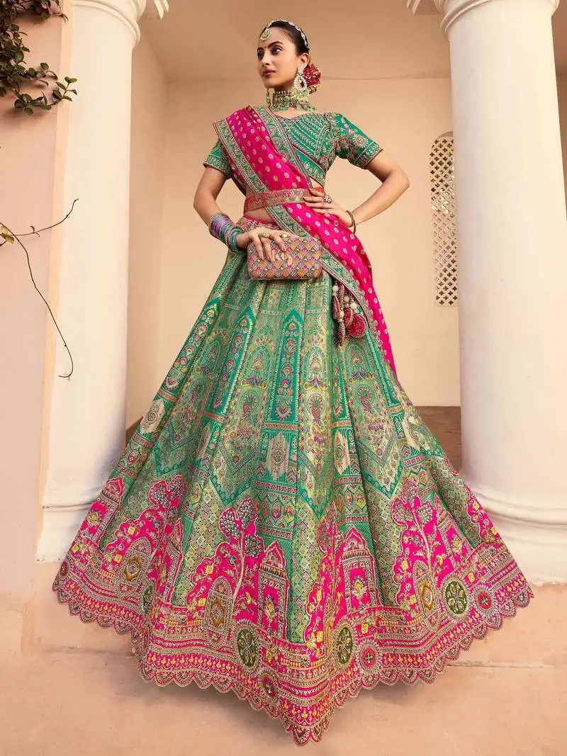 Teal green sequins embroidered banarasi silk lehenga choli