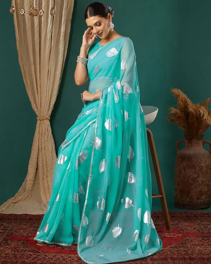 Turquoise lace foil screen printed georgette saree with blouse