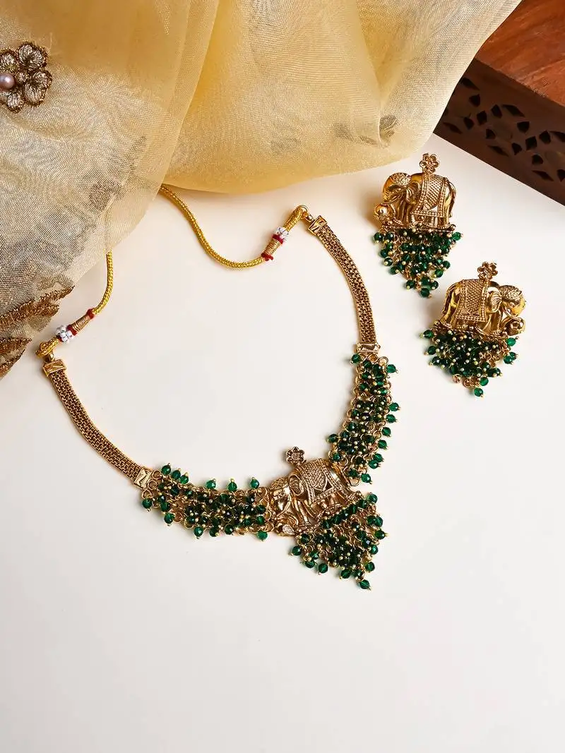 Gold plated gaj necklace set with green hydra beads