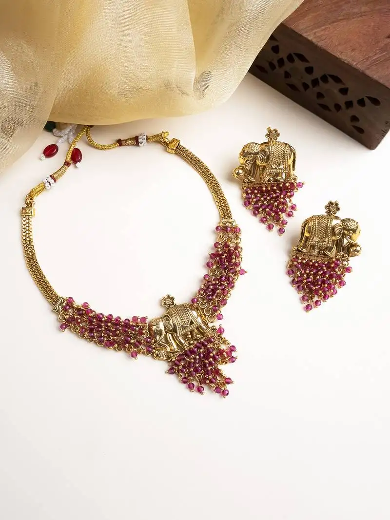 Gold plated gaj necklace set with red hydra beads