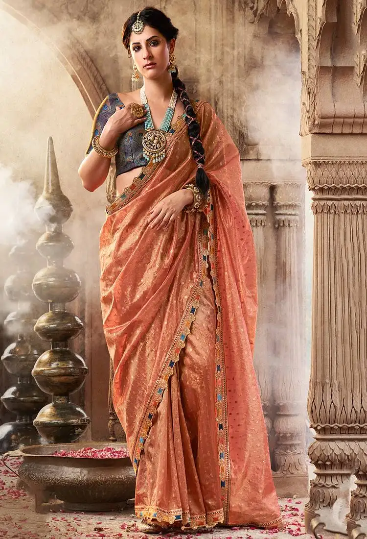 Peach tissue woven with multicolored lace border saree with blouse