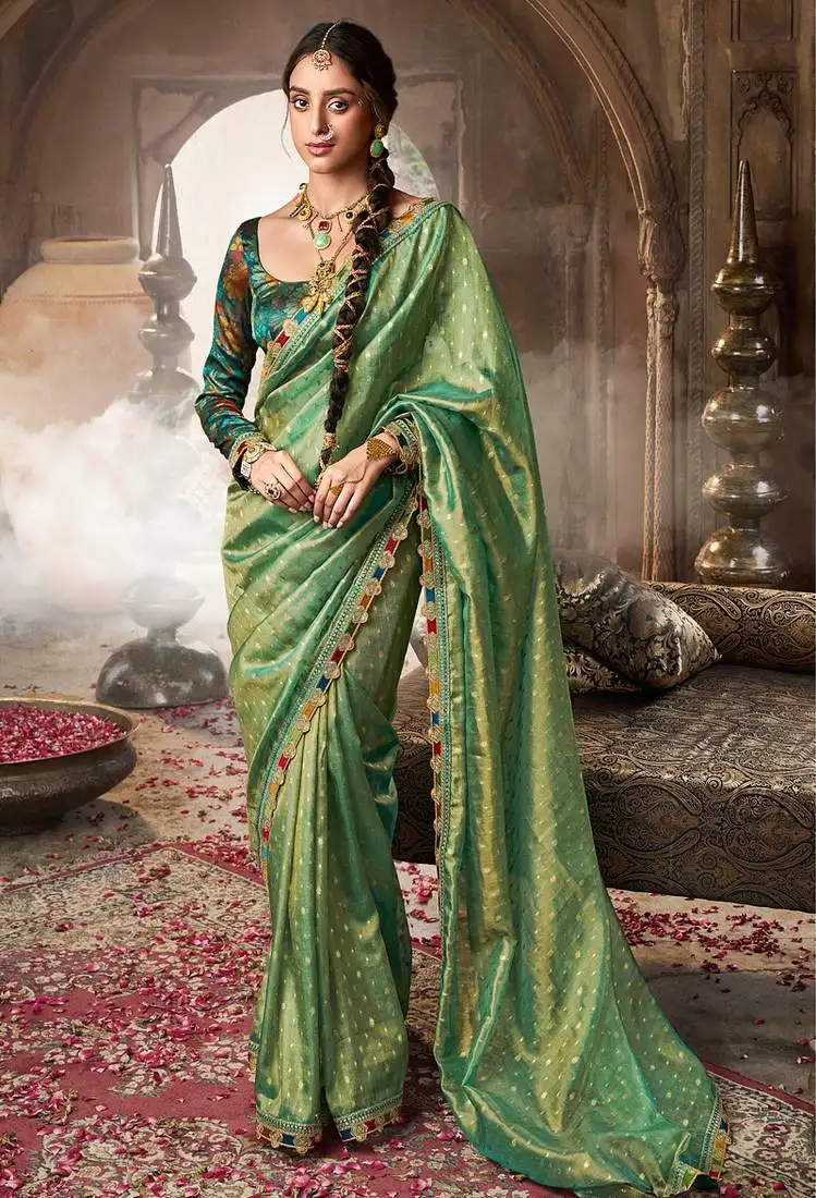 Sea green tissue woven with multicolored lace border saree with blouse