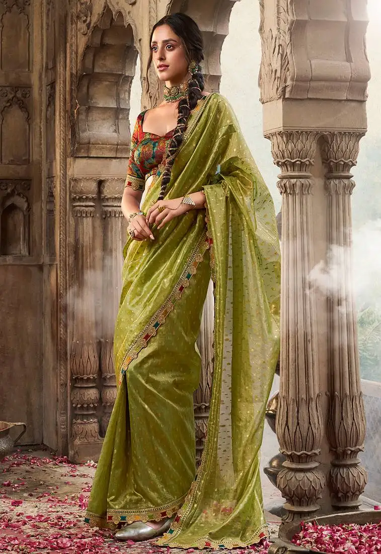 Parrot green tissue woven with multicolored lace border saree with blouse