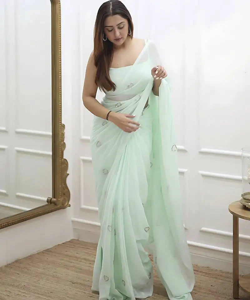 Pastel green plain georgette saree with heart motifs