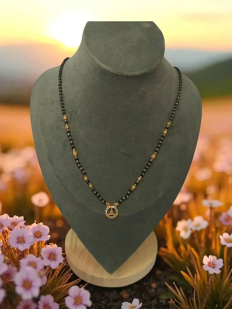 Gold plated ad mangalsutra with teardrop pendant for women | traditional black beads necklace