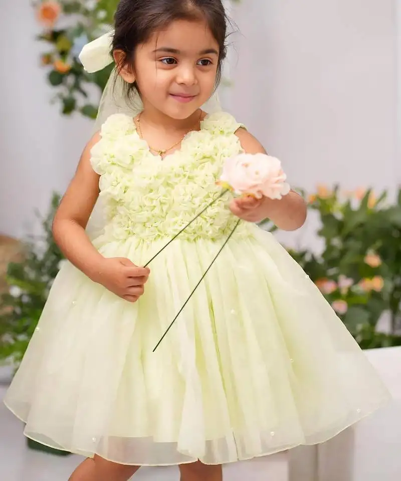 Light green organza woven daffodil frock for girls