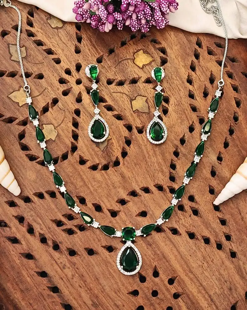 Delicate emerald green stone necklace set with matching drop earrings