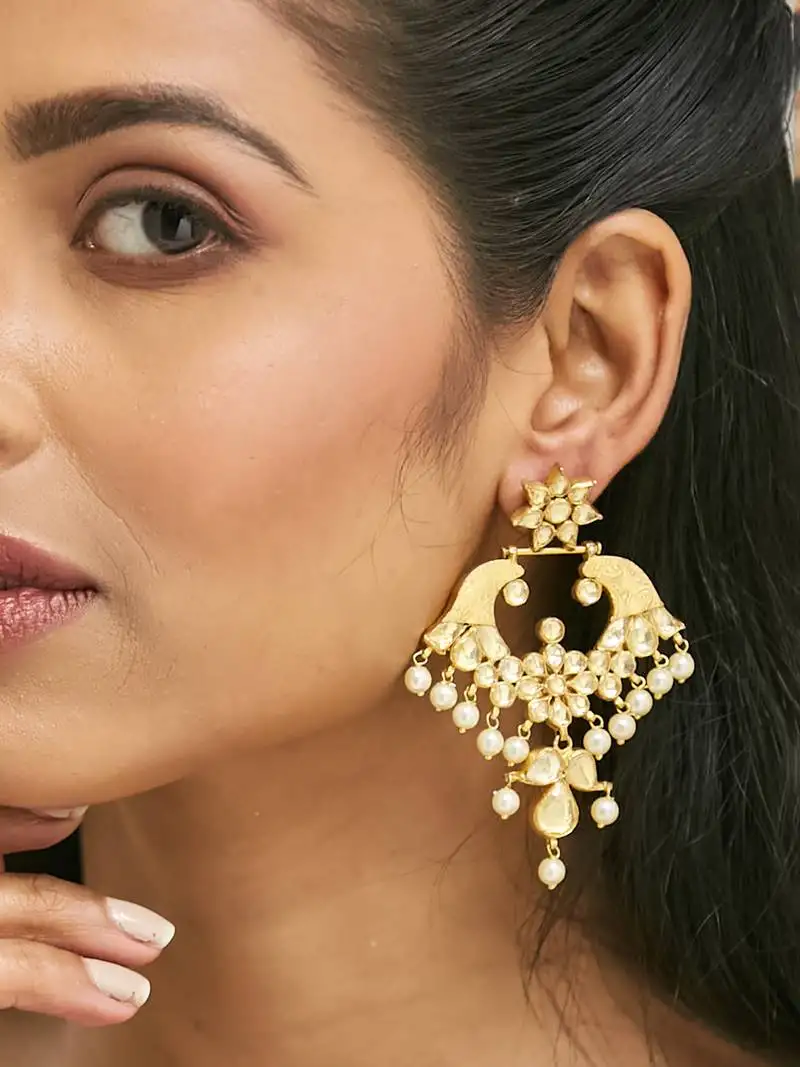 Gold plated kundan and pearl earrings with floral stud and intricate crescent design chandbalis