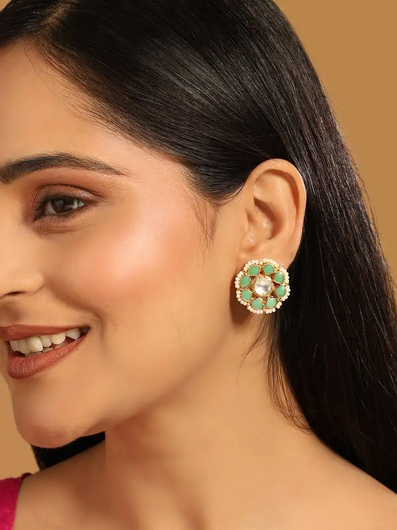 Gold plated green kundan studded & pearls beaded floral shaped studs