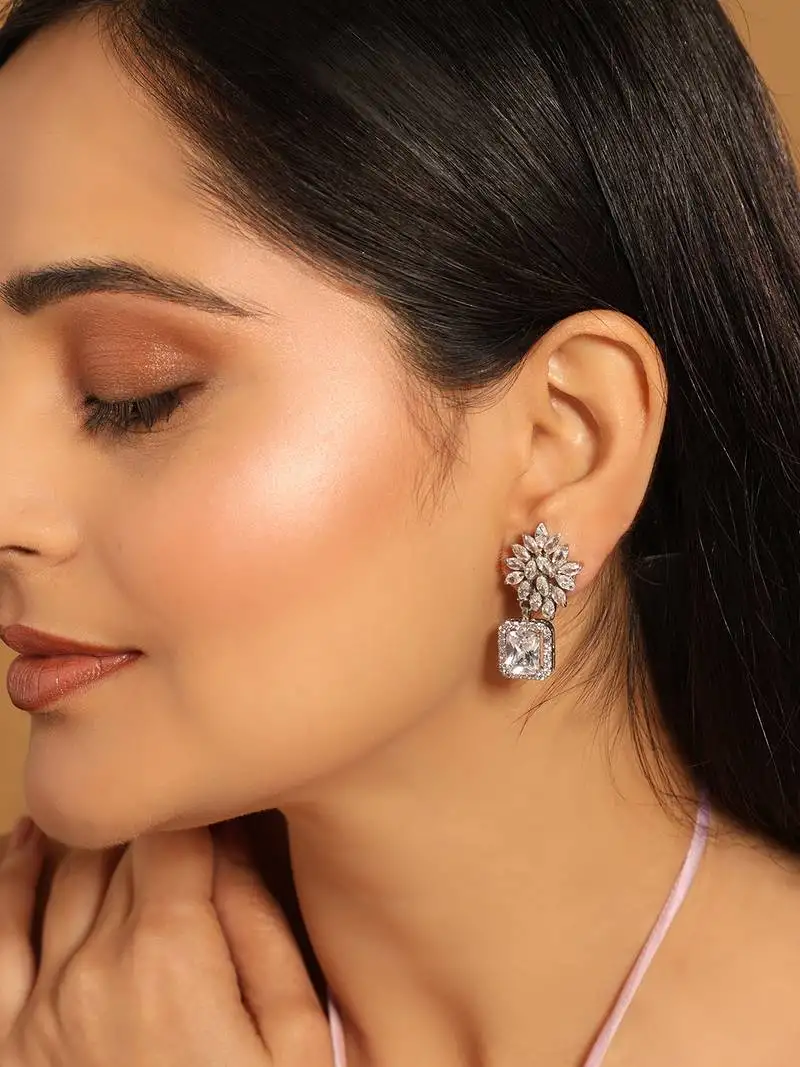 Rhodium plated rhinestone studded floral minimal cotemporary studs