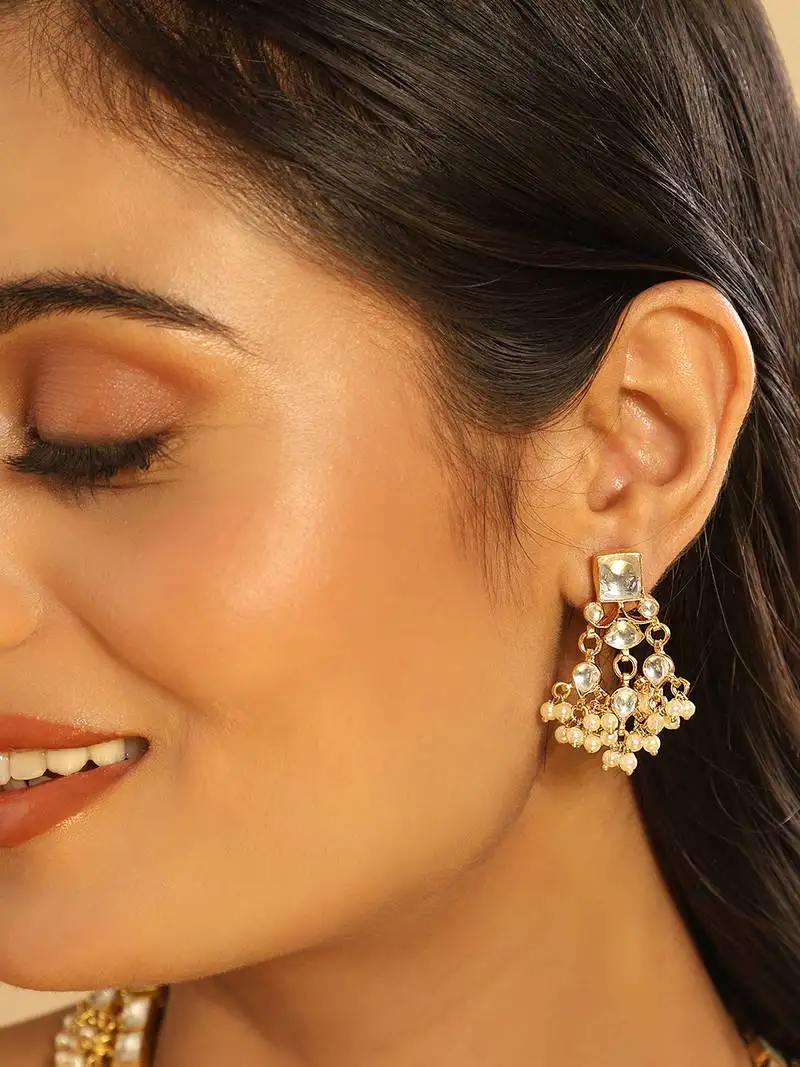 Gold plated ivory dusk kundan earrings