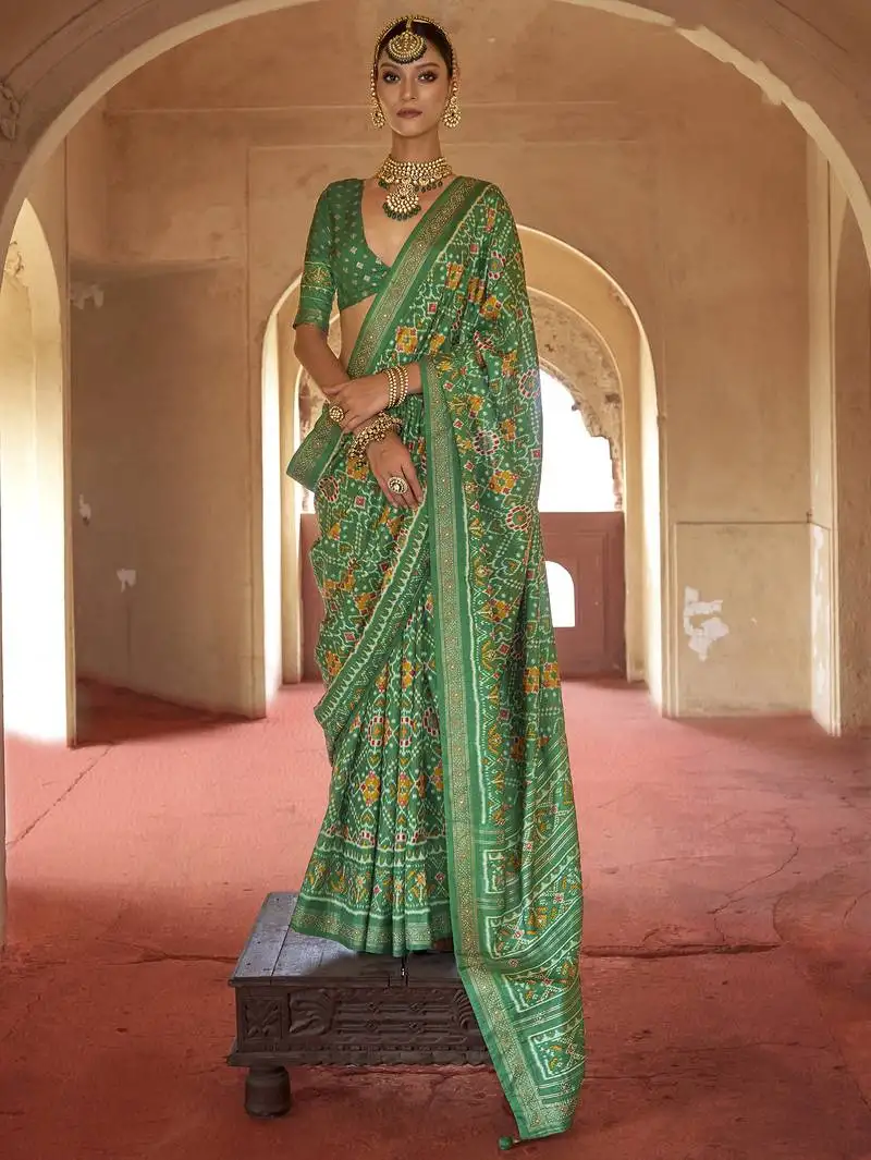 Green poly viscose silk patola printed saree with heavy dimond swarovski work border