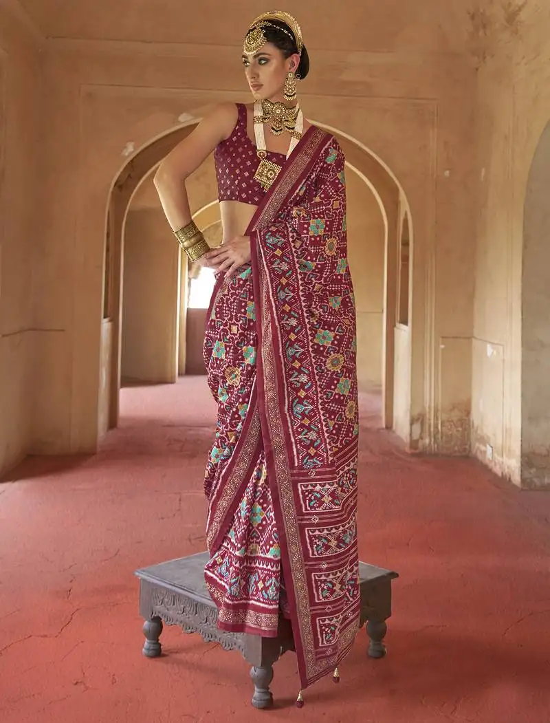 Maroon poly viscose silk patola printed saree with heavy dimond swarovski work border