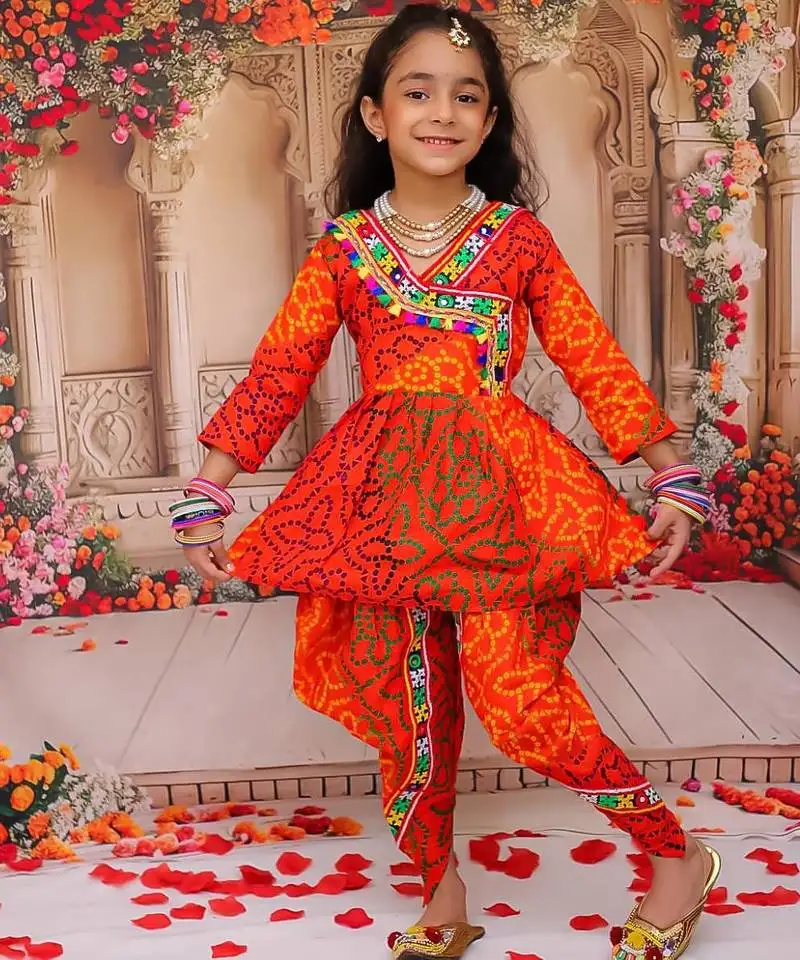 Orange printed cotton kurti with dhoti set for girls