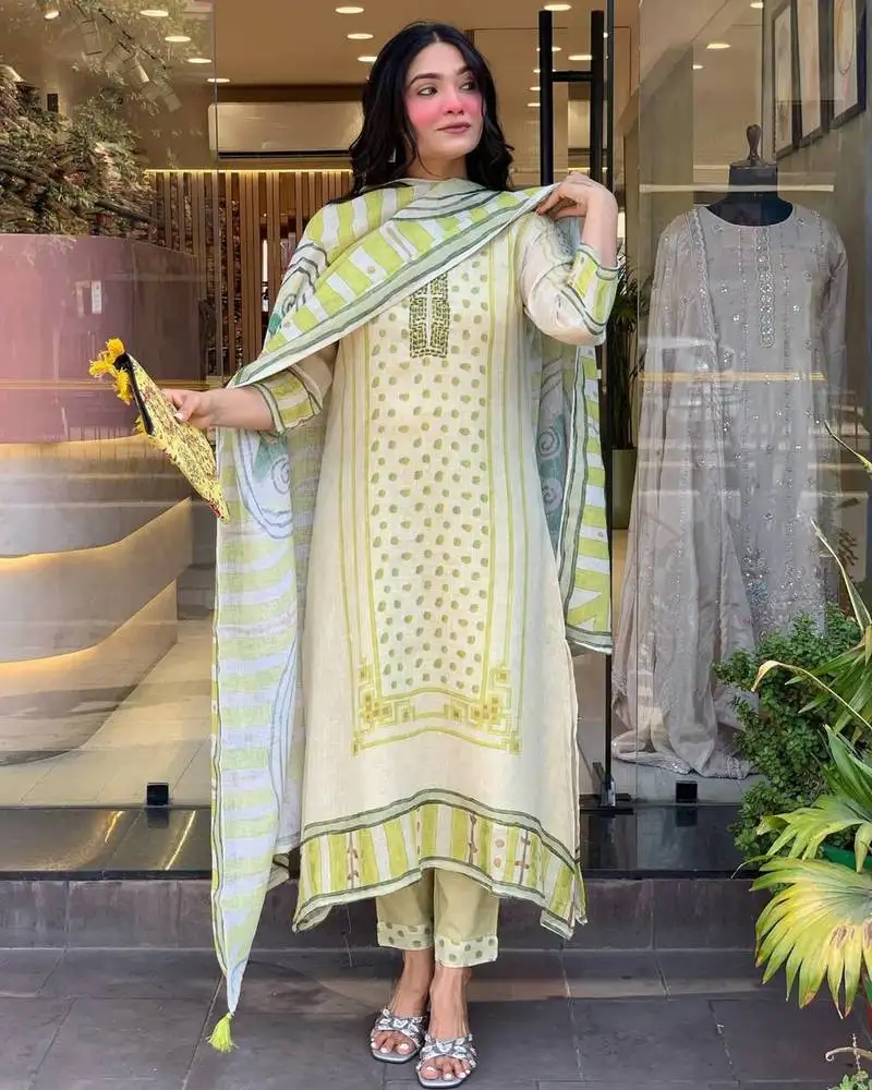 Off white colored party wear embroidered stitched linen silk pant style kurti suit with duppatta