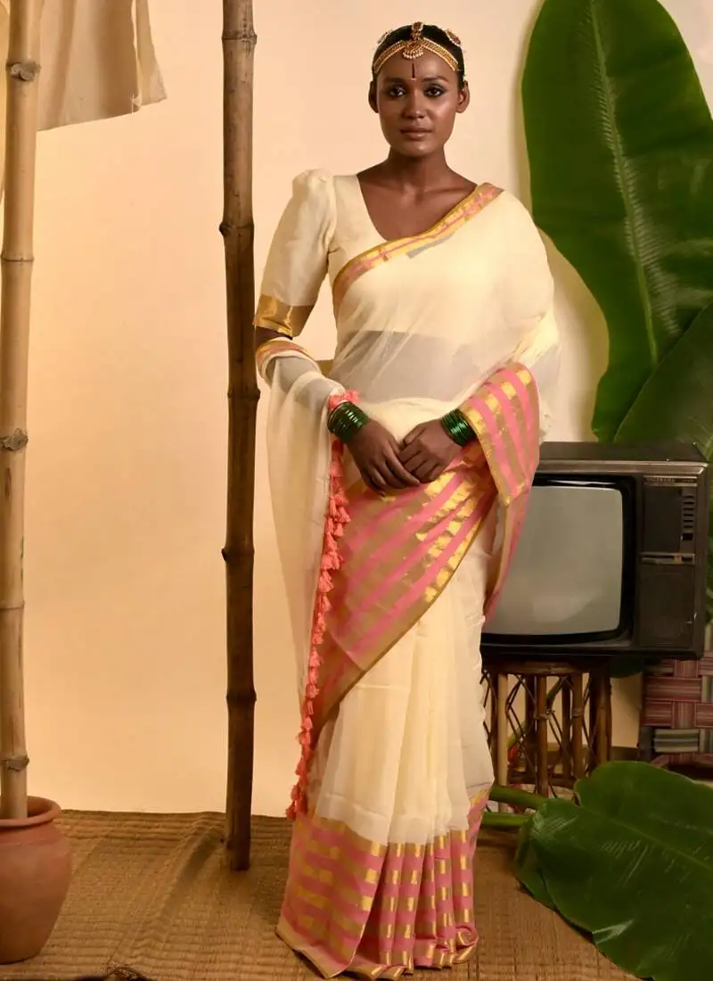 Cream white cotton saree with pink and golden striped border