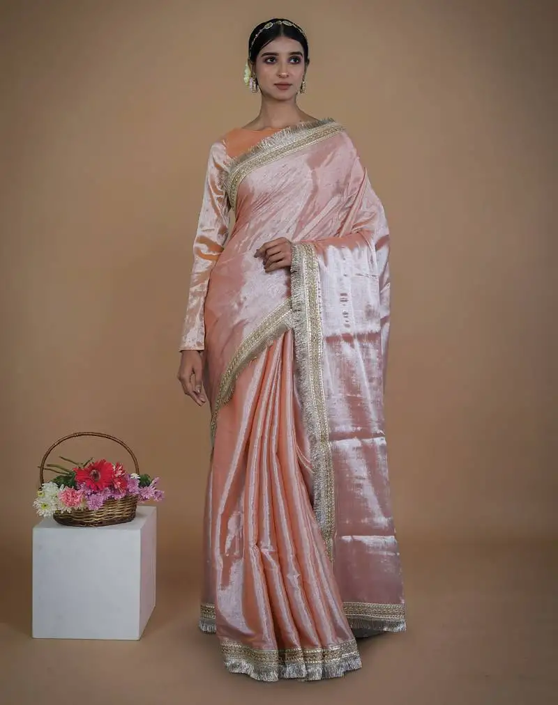 Neon orange handwoven tissue saree with matte gold lace