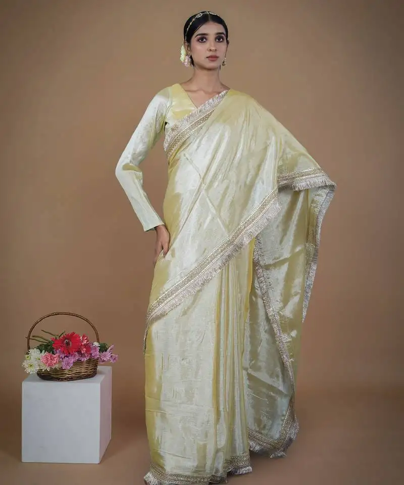 Neon yellow handwoven tissue saree with matte gold lace