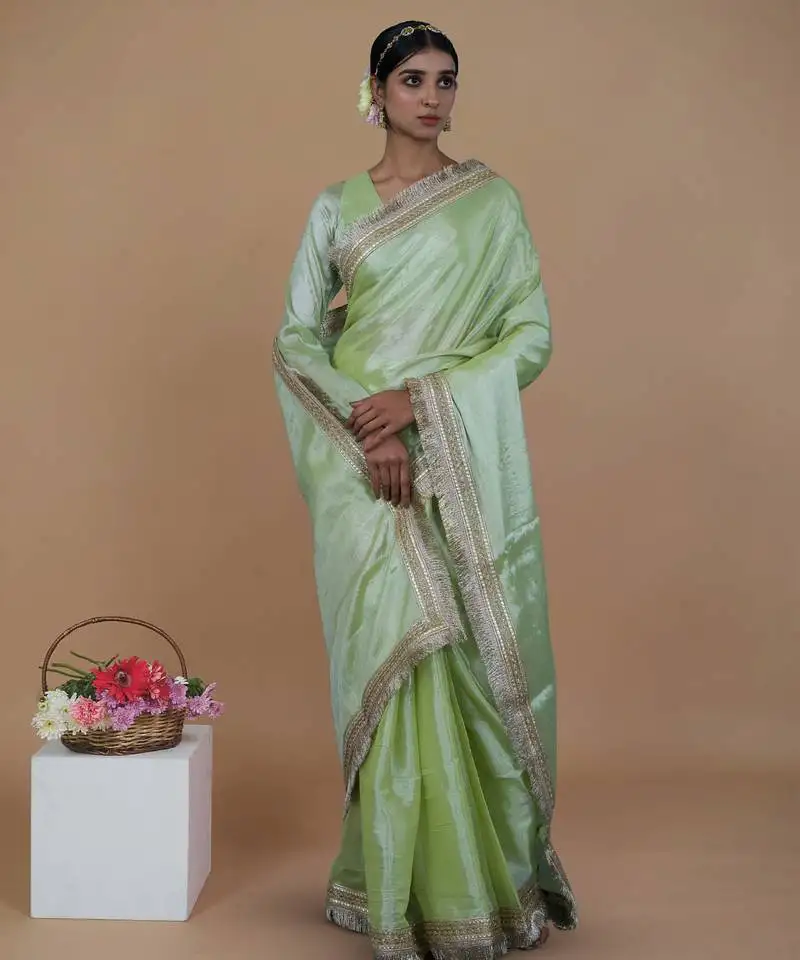 Green handwoven tissue saree with matte gold lace