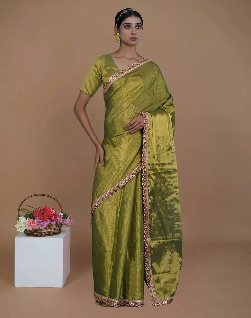 Green handwoven tissue saree with scalloped lace