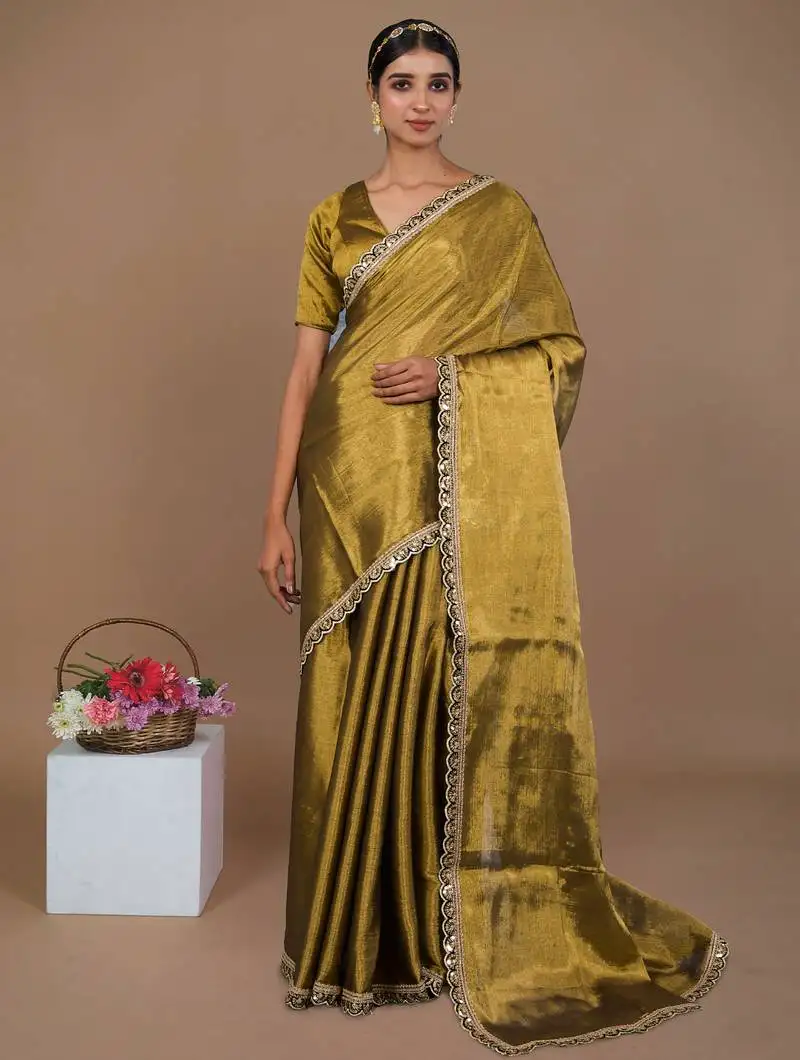 Golden handwoven tissue saree with black scalloped lace