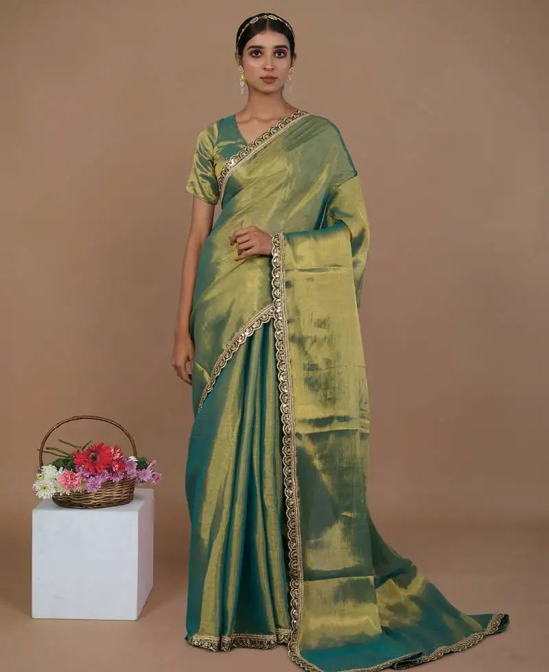 Sea green handwoven tissue saree with scalloped lace