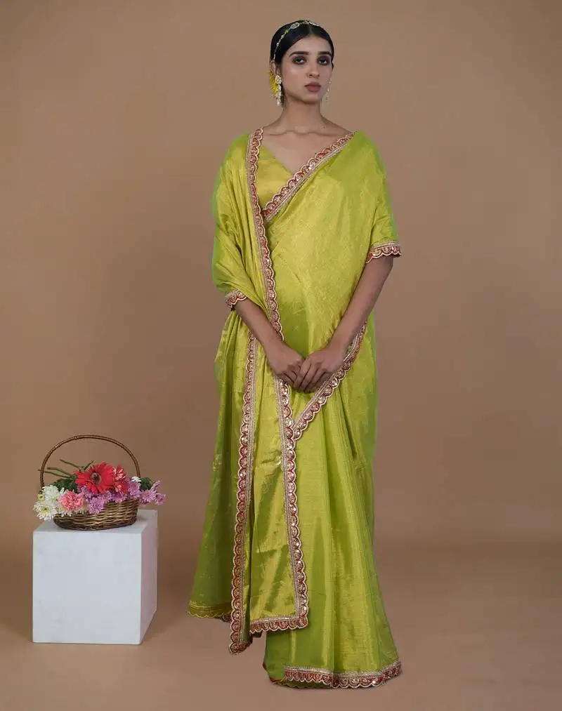 Neon green handwoven tissue saree with scalloped lace