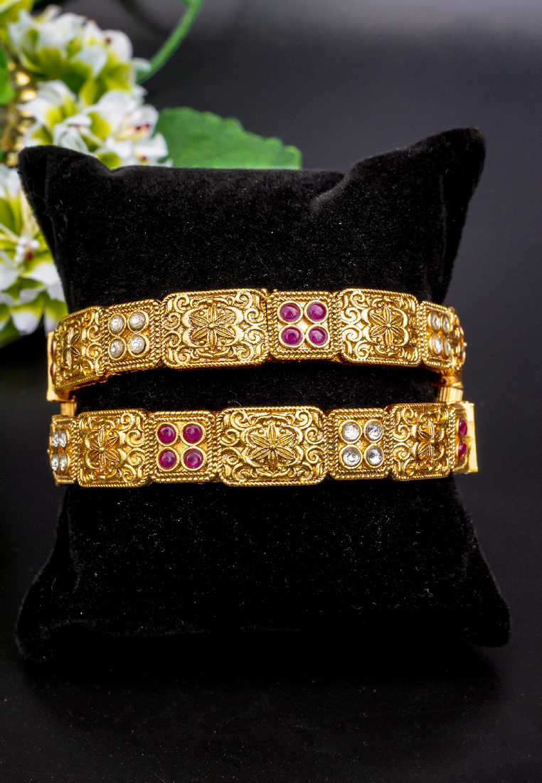 Regal elephant motif gold bangles with enamel detailing