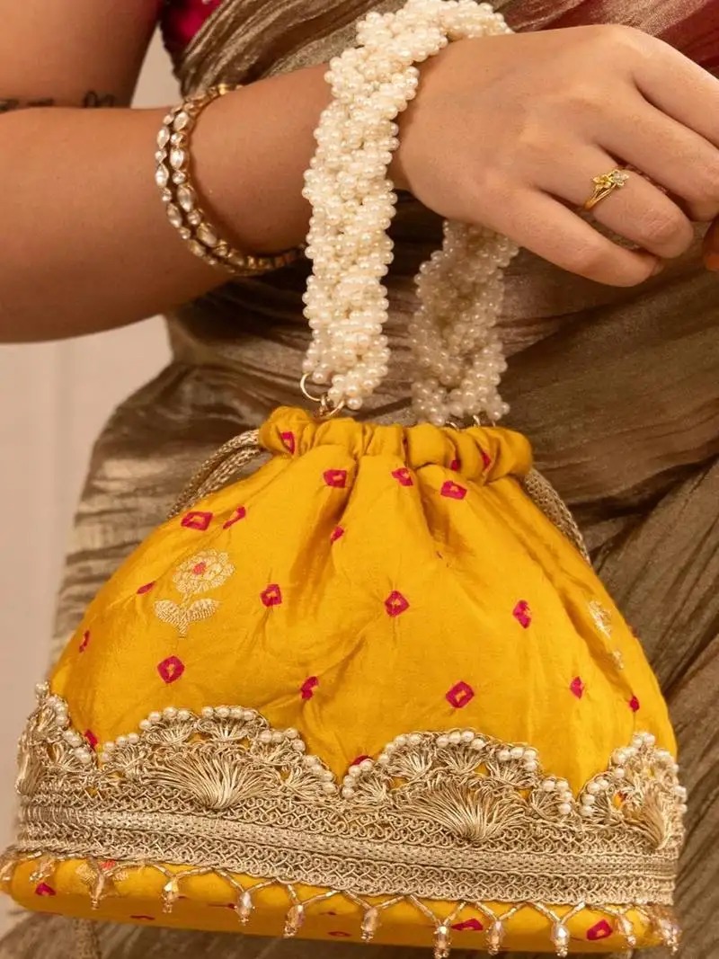 Yellow silk embroidered potli bag