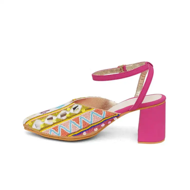 Pink embroidered leather heels