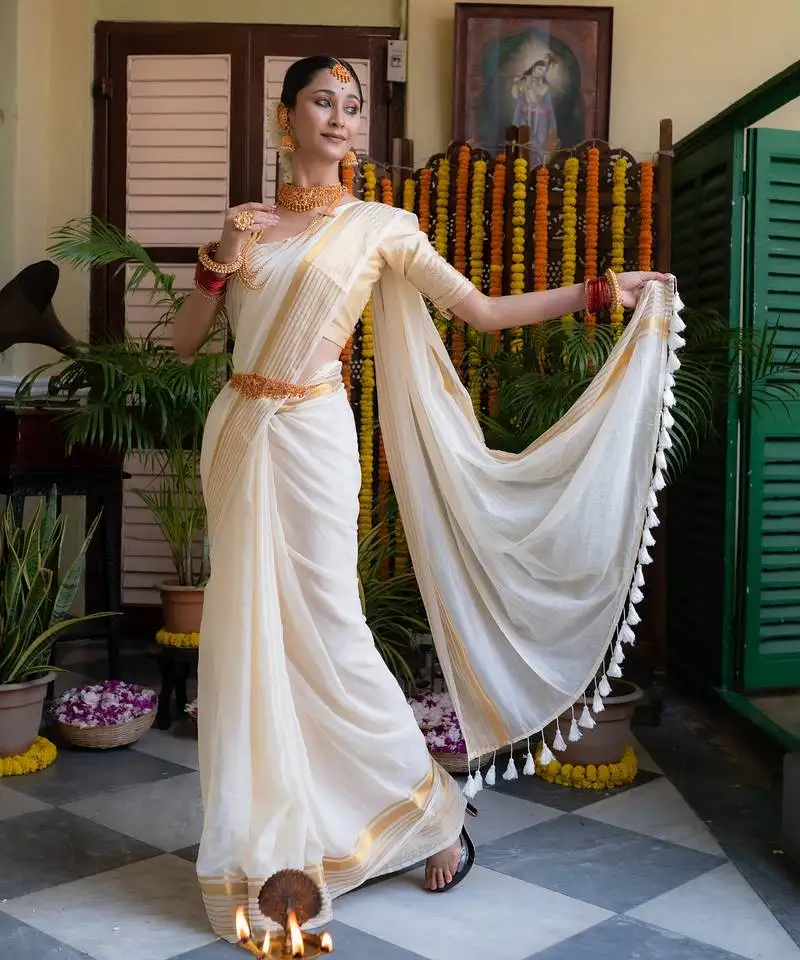 Beige mul cotton saree with gold zari border