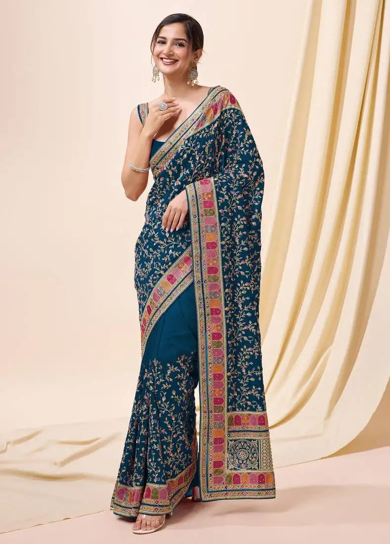 Teal vichitra silk blend embroidered swarovski work saree with unstitched blouse