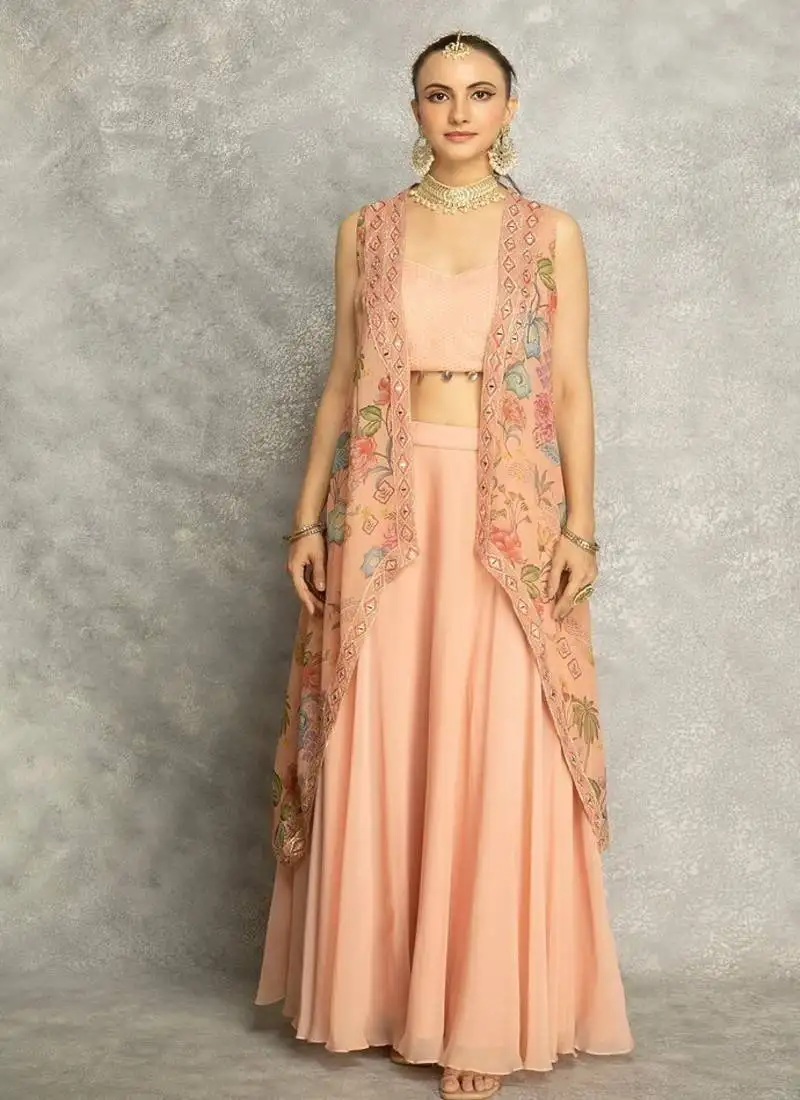 Peach lehenga with embroidered cape and crop top bustier
