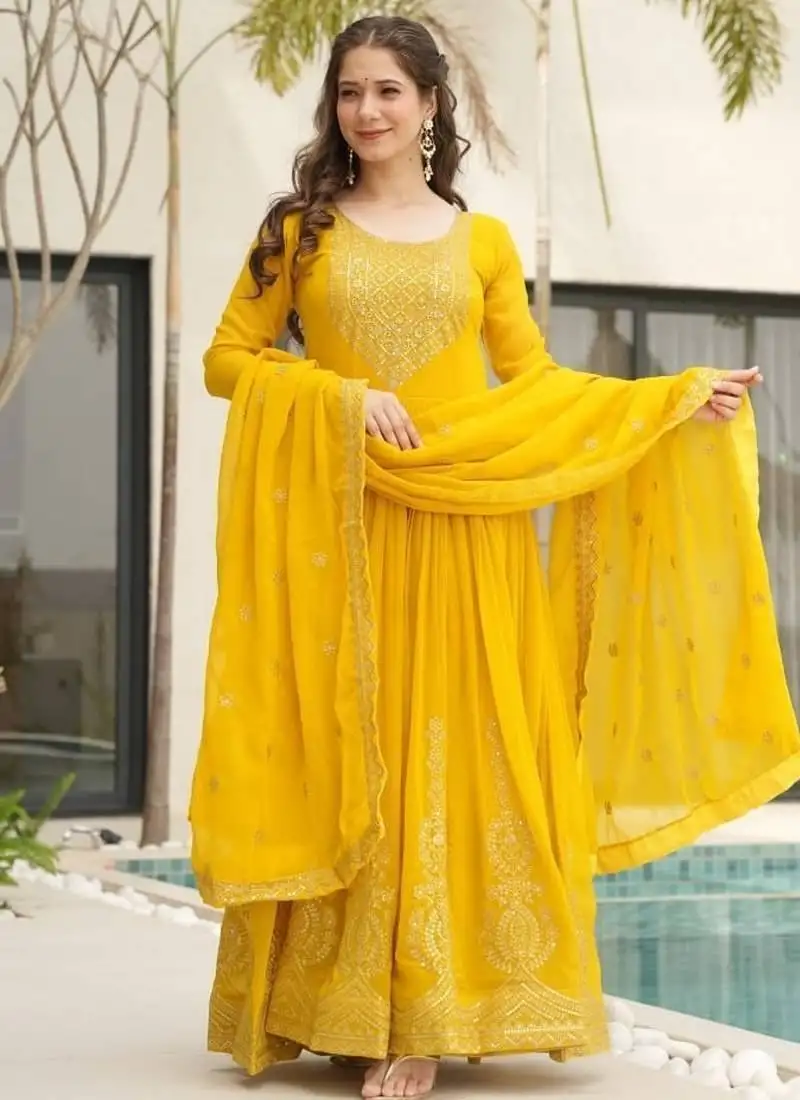 Yellow faux blooming with embroidery zari sequins work gown stitched