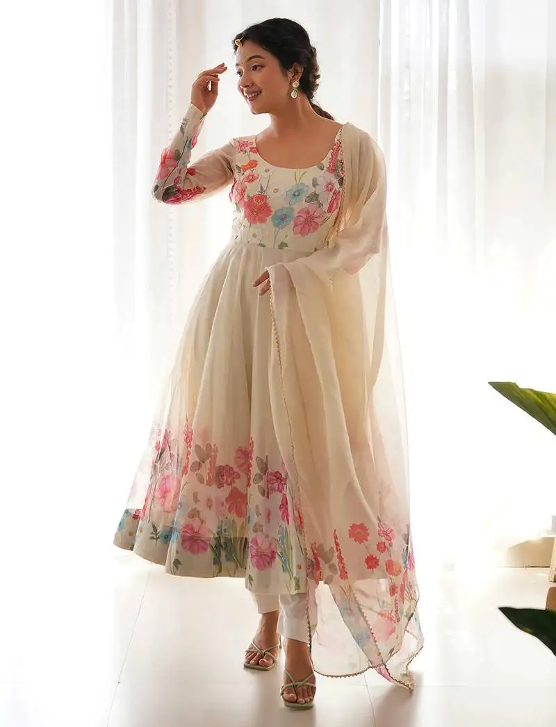 Featuring cream color ethnic wear gown set stitched