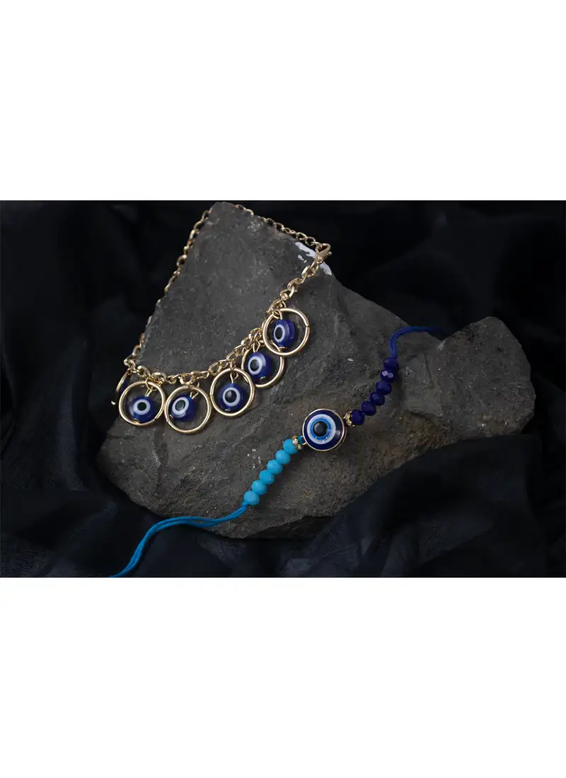 Combo of fancy evil eye handcrafted protection rakhi for bhaiya bhabhi with roli chawal and written greeting note.